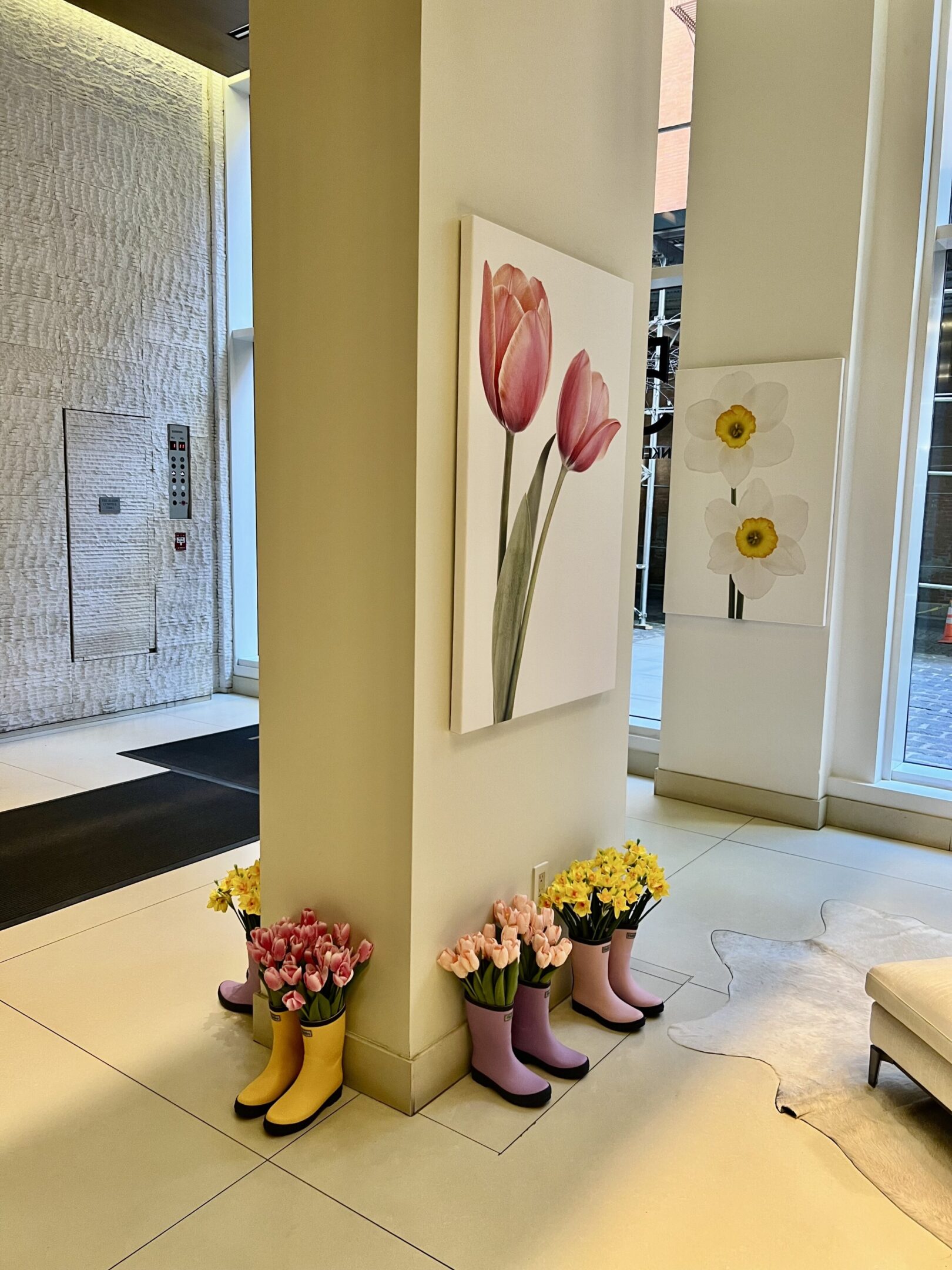 Spring flowers in colorful rain boots.