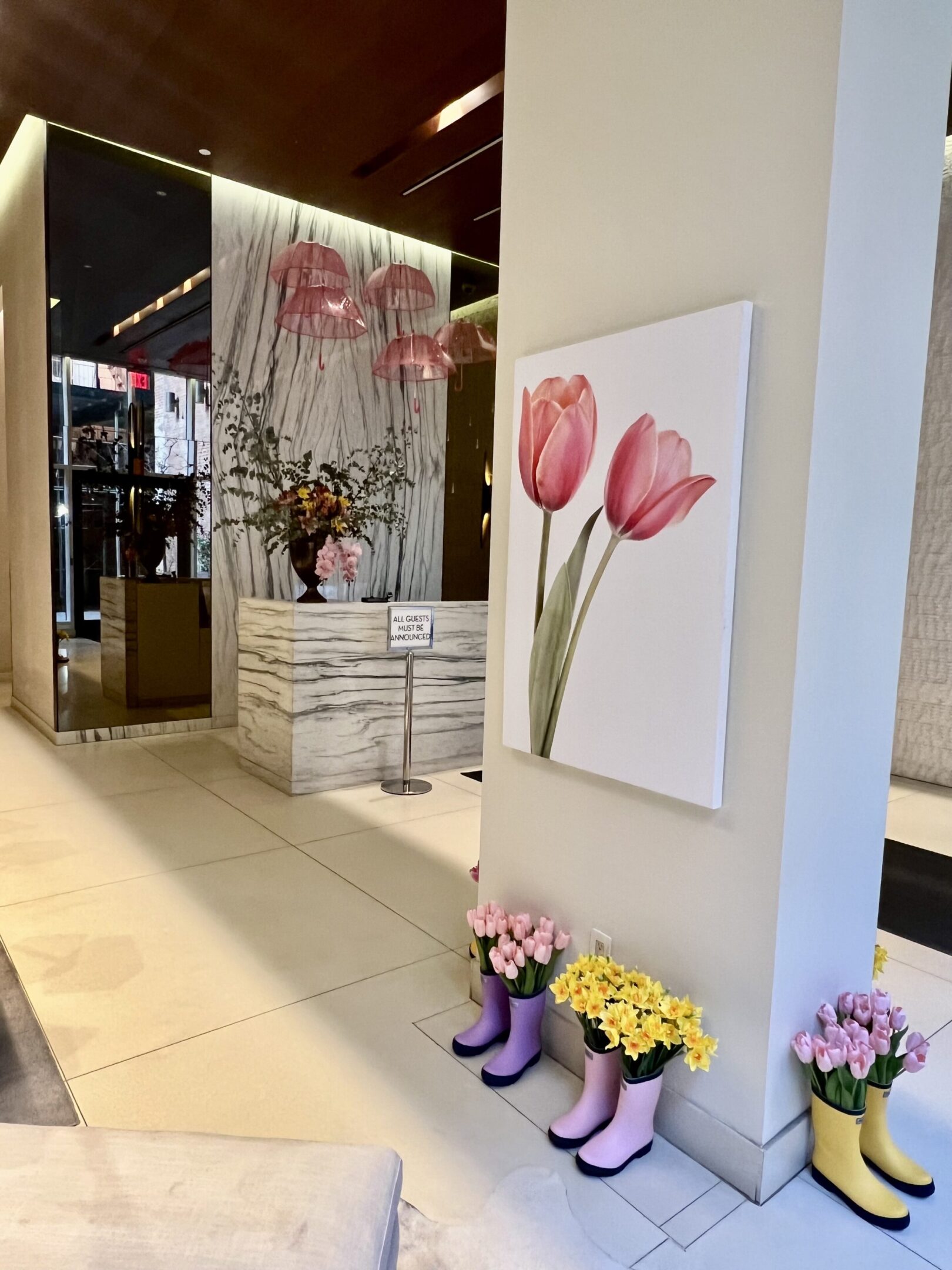 Lobby with tulips and pink umbrellas.