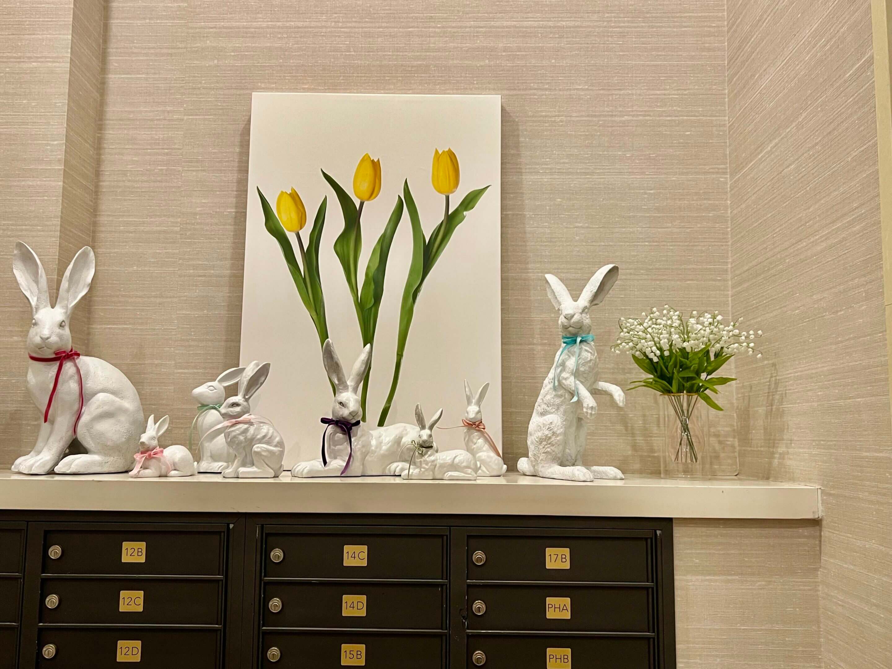 White rabbits, yellow tulips, spring decor.